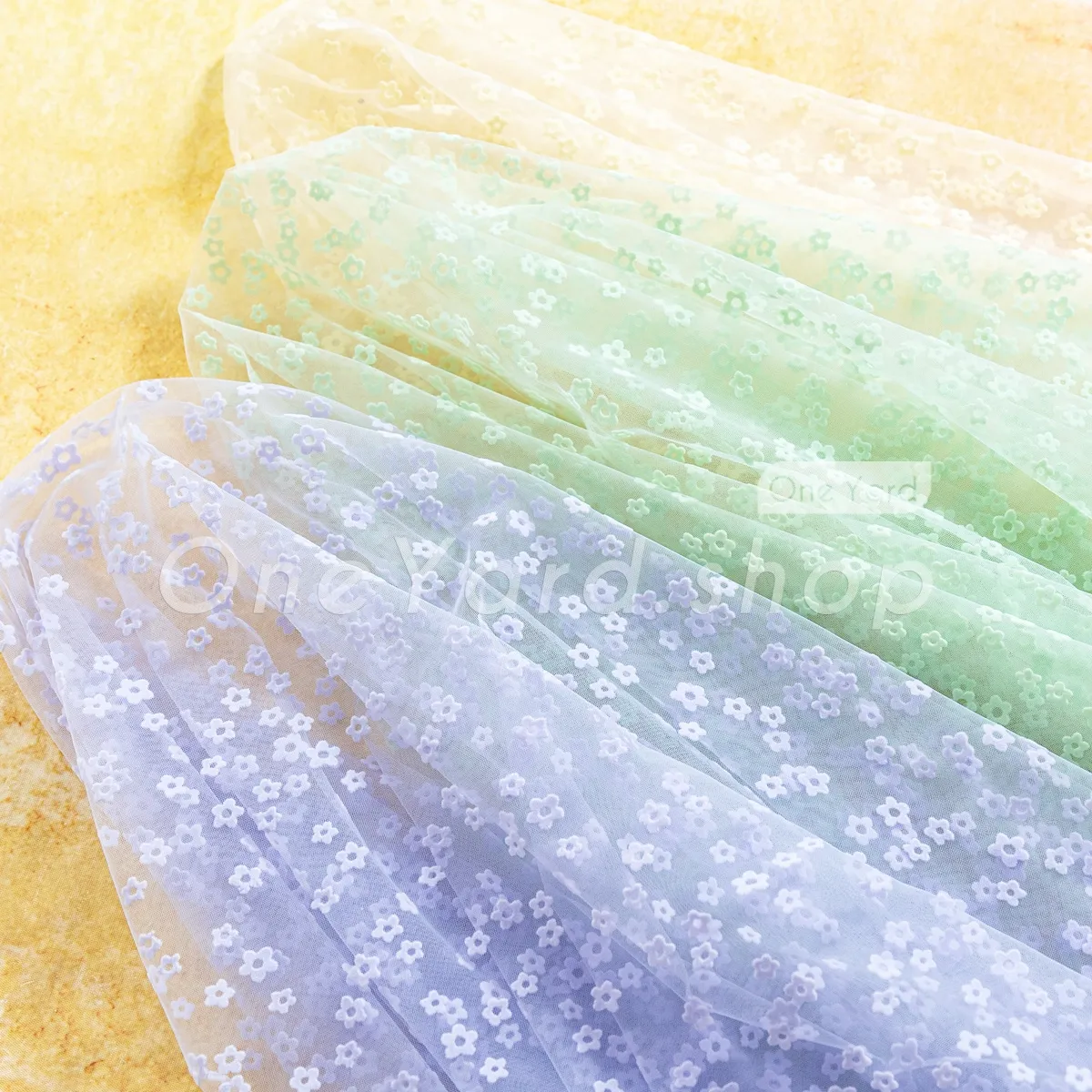 pastel tiny cinquefoil flocked floral tulle mesh fabric pastel tiny cinquefoil flocked floral tulle mesh fabric