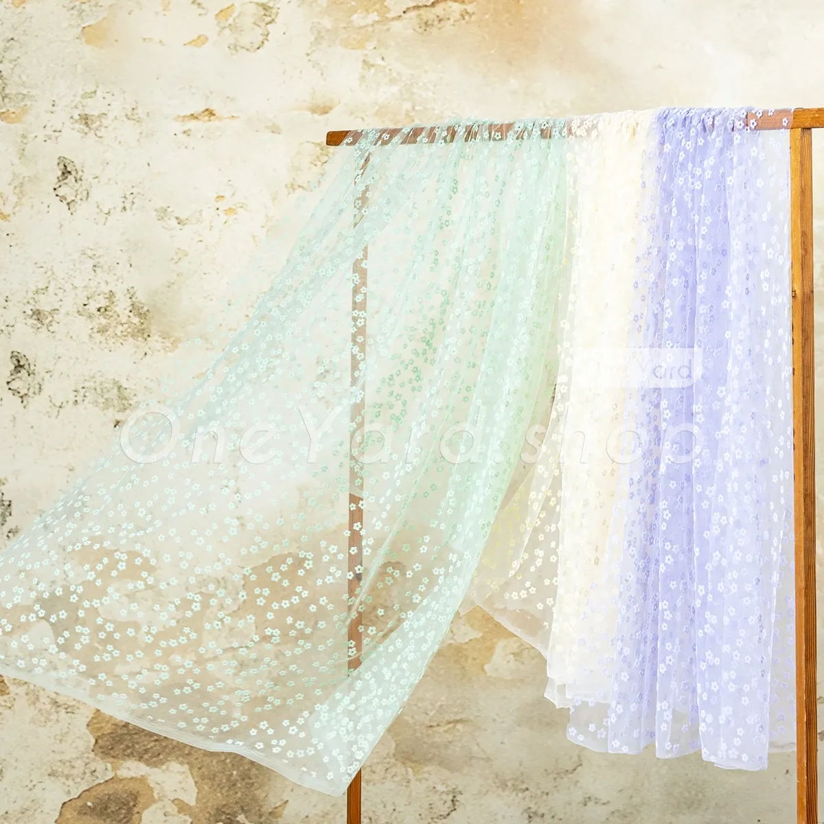 sheer tulle background adorned with dainty little flowers sheer tulle background adorned with dainty little flowers