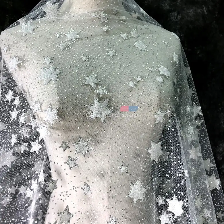 uneven size of glitter stars glued tulle material for making special occasion dress