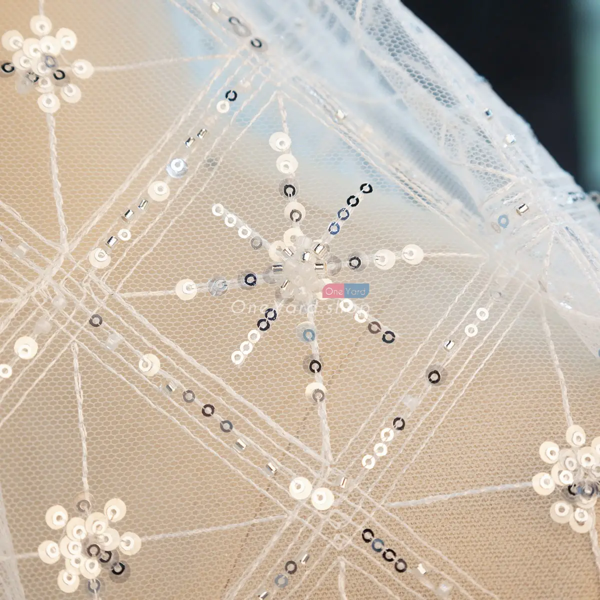 sequinned white mesh tulle fabric