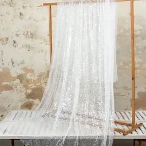 sparkly transparent sequins beads mixed over mesh glitter fabric by the yard