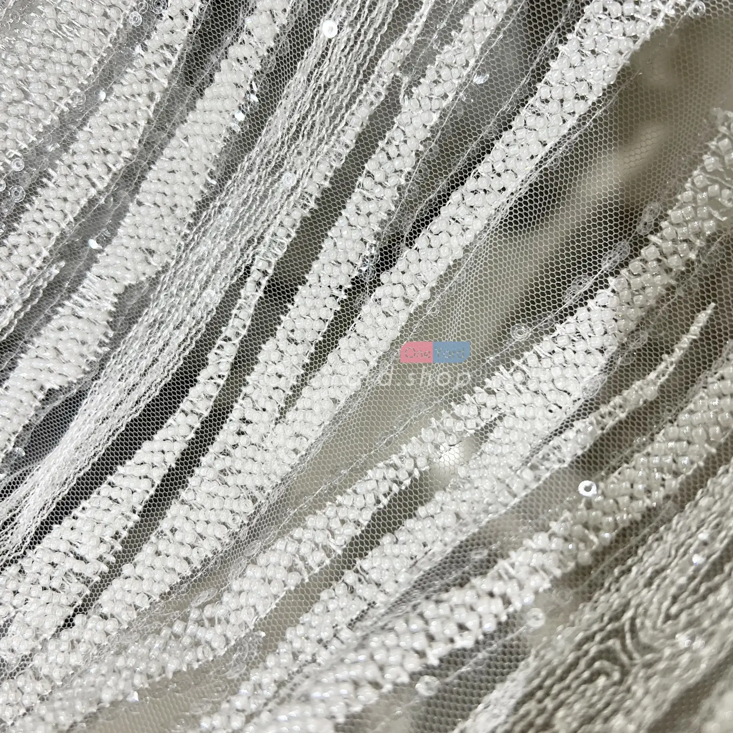 luxury white tube beads on mesh heavily couture fabric by the yard
