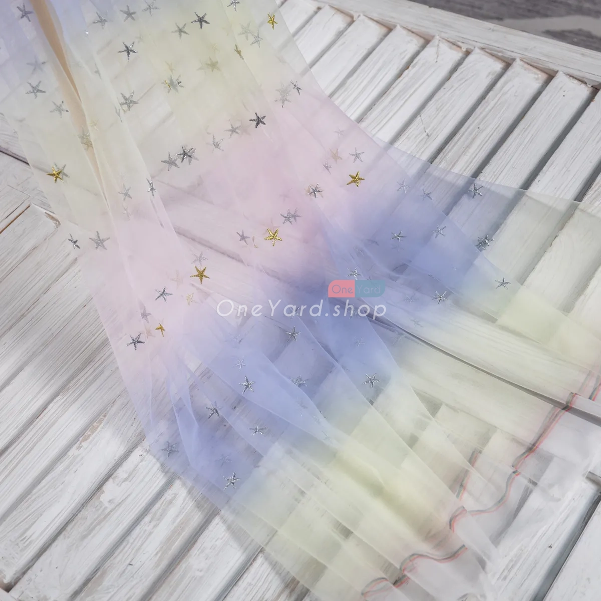 daffodil to blue to pink ombre soft tulle with silver gold stars