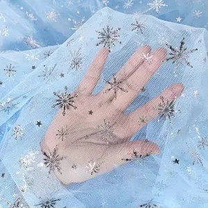 glitter silver snowflake glued on mesh fabric by the yard