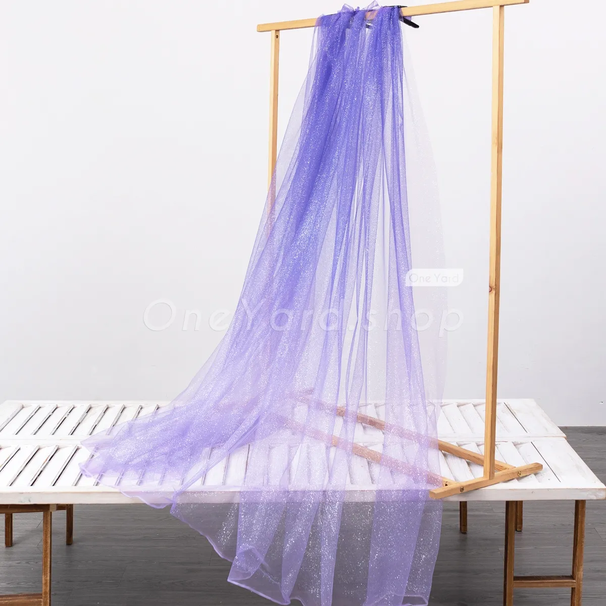silver glitter powder glued bluish purple to violet tulle fabric