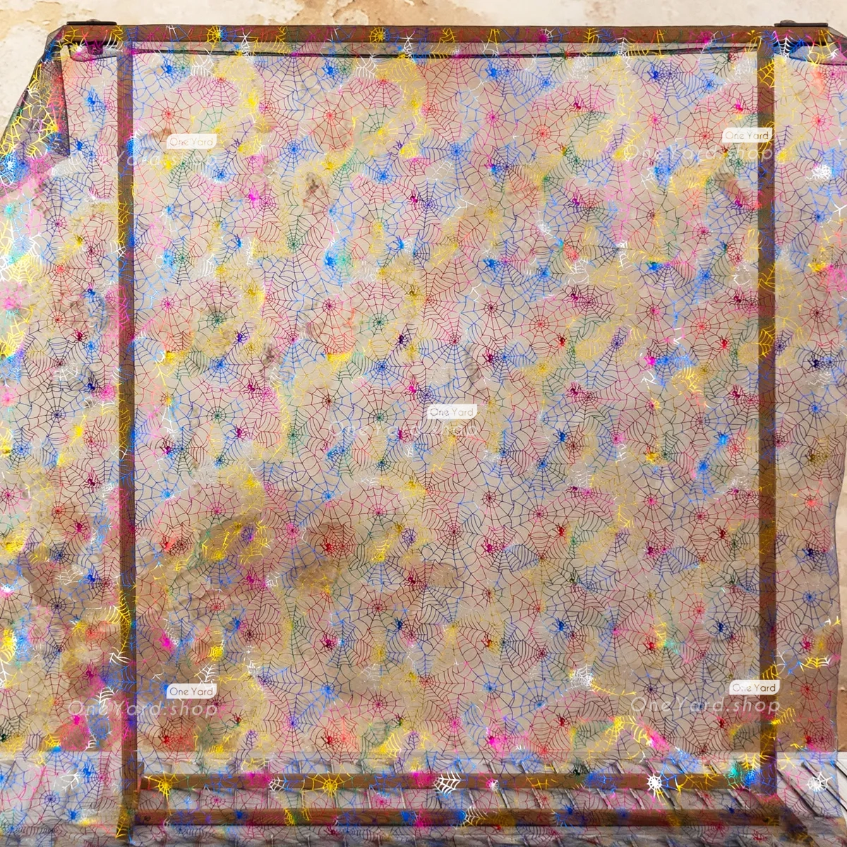 elevate your Halloween decorations with this multi color spider web mesh