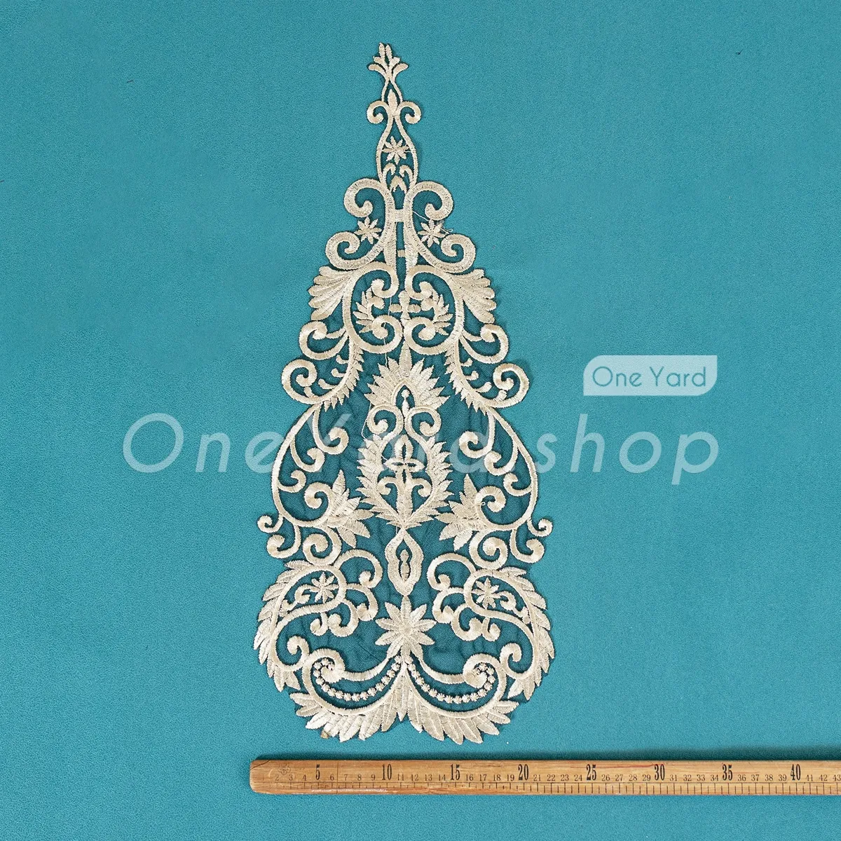 lustrous light gold thread on black mesh lace applique