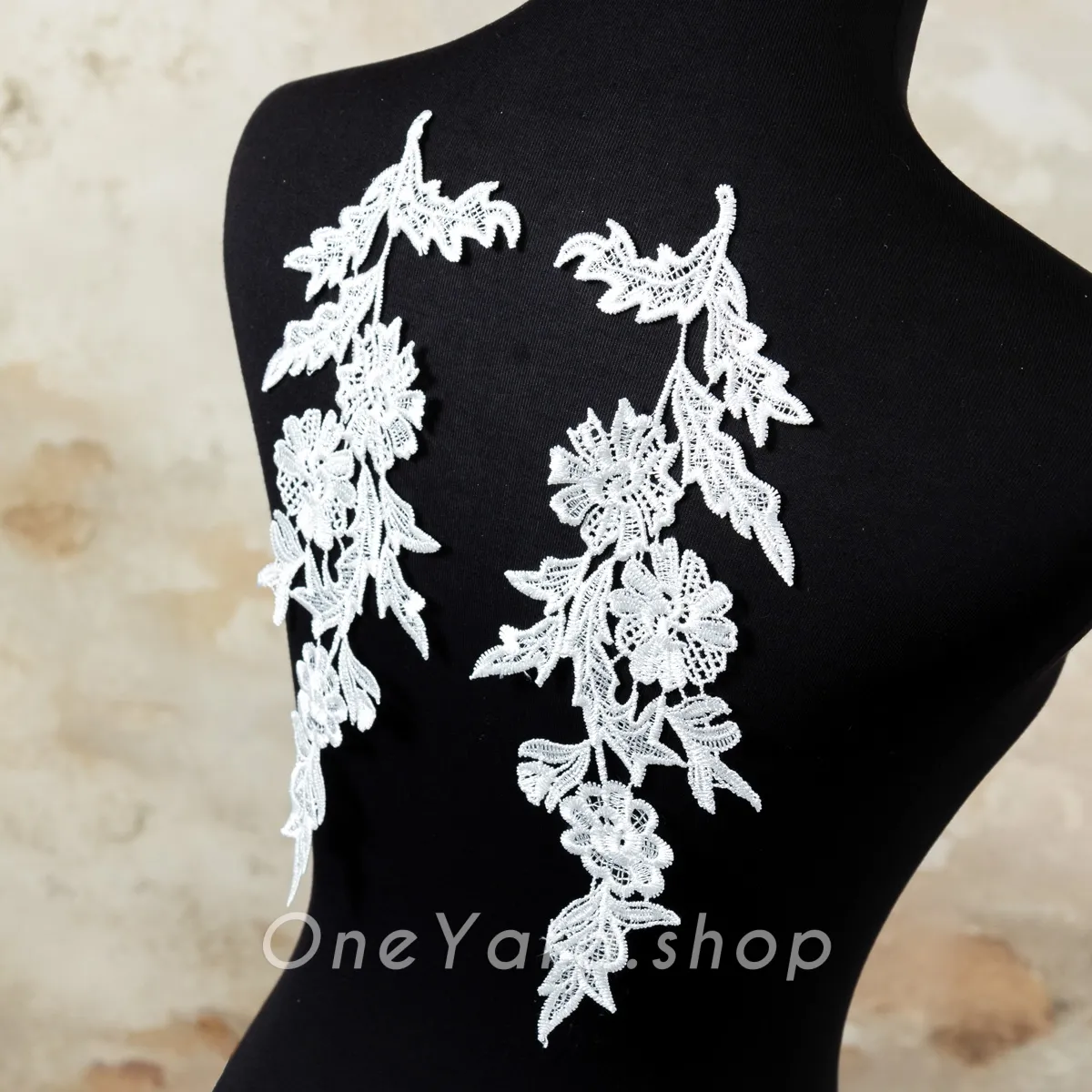 pair of off white floral chemical lace appliques
