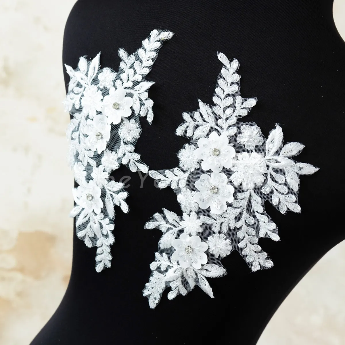 white beaded lace motifs