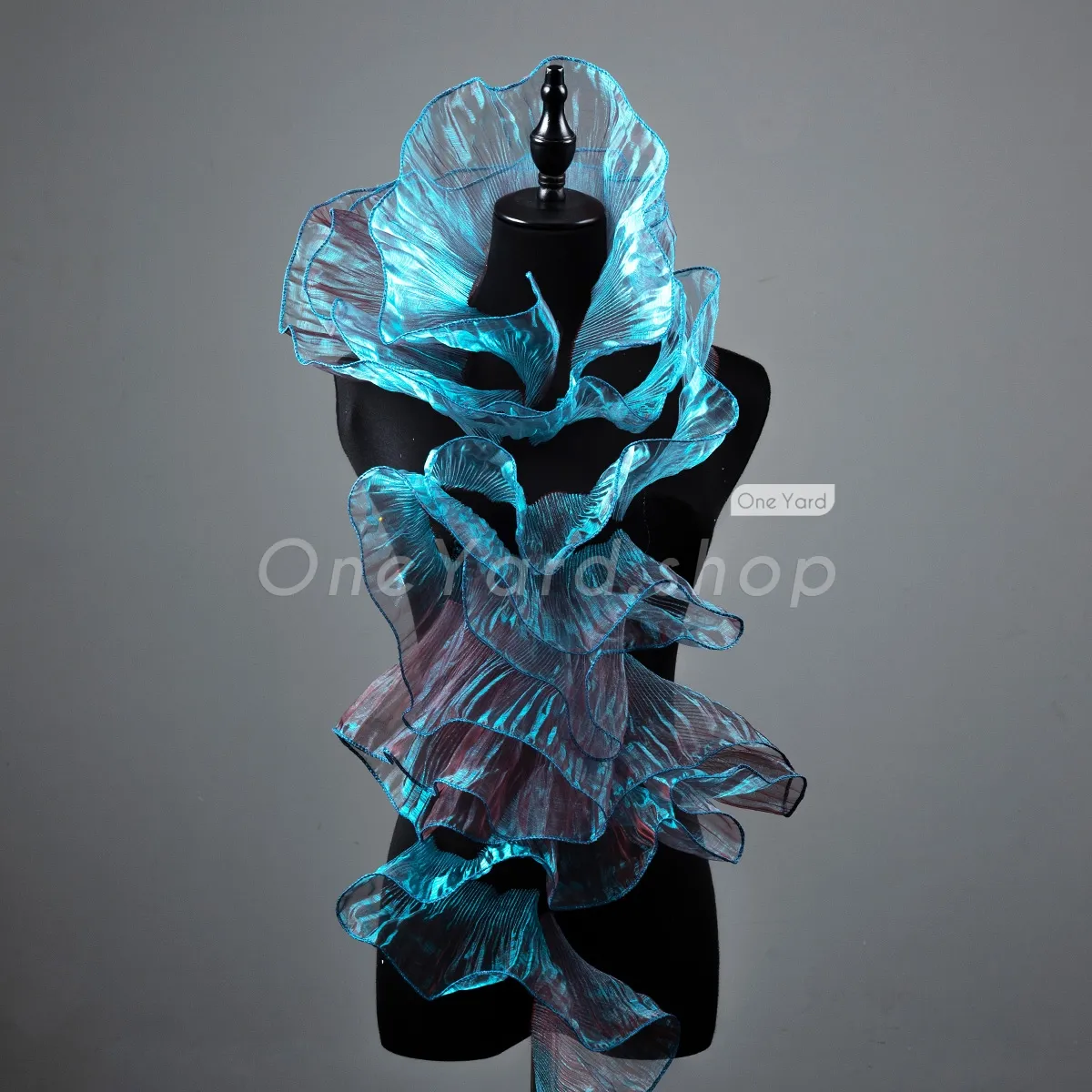 the peacock blue and ruby iridescent creates a stunning visual effect