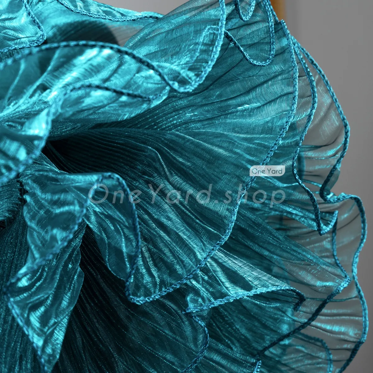 shimmering sheer peacock blue organza