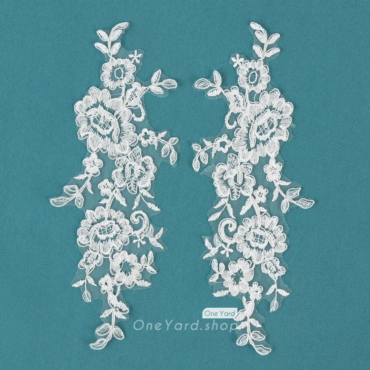 intricate floral lace motifs adorned with shimmering sequins