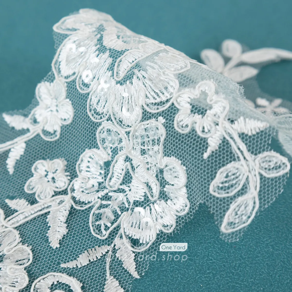 shimmering sequinned ivory lace applique