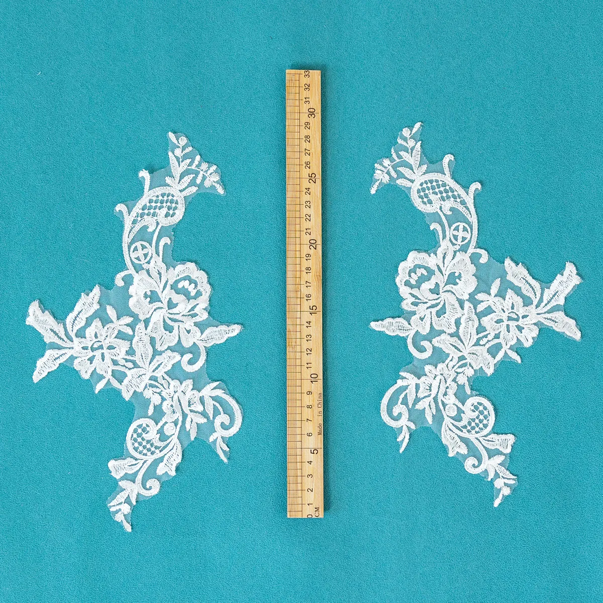 blooming roses delicate foliage and graceful scrollwork lace appliques