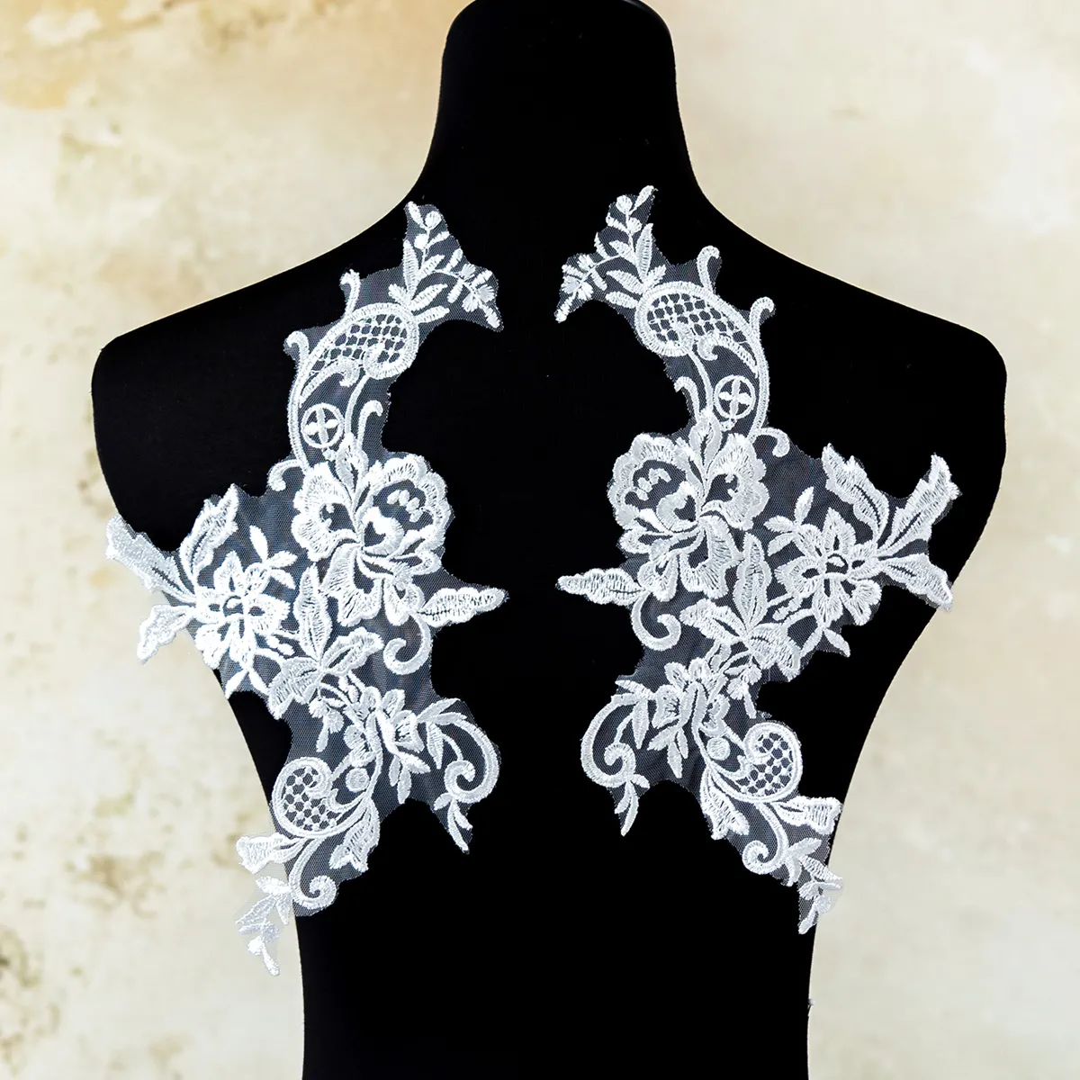 symmetrical off white floral scroll lace applique pair