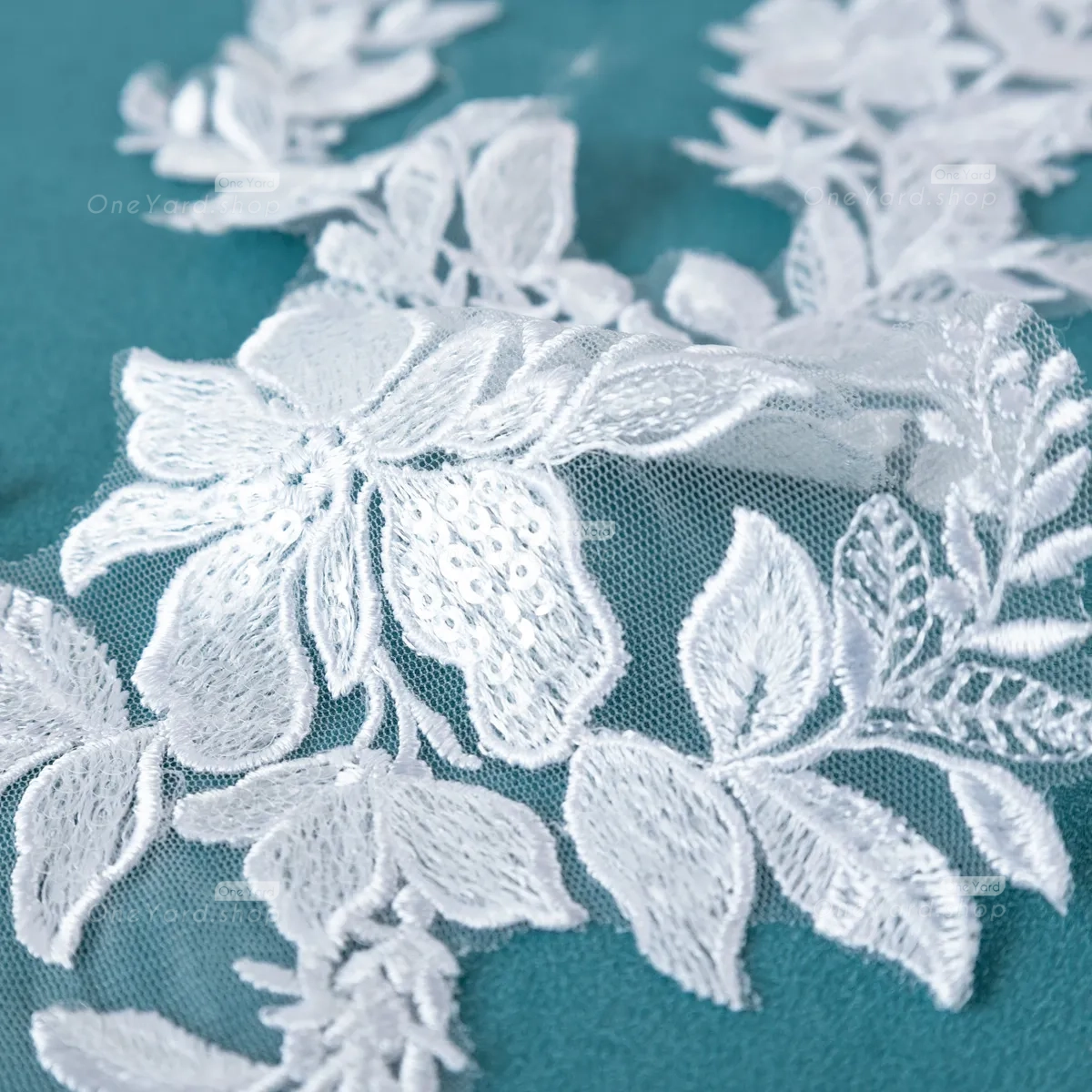 sequinned white lace applique