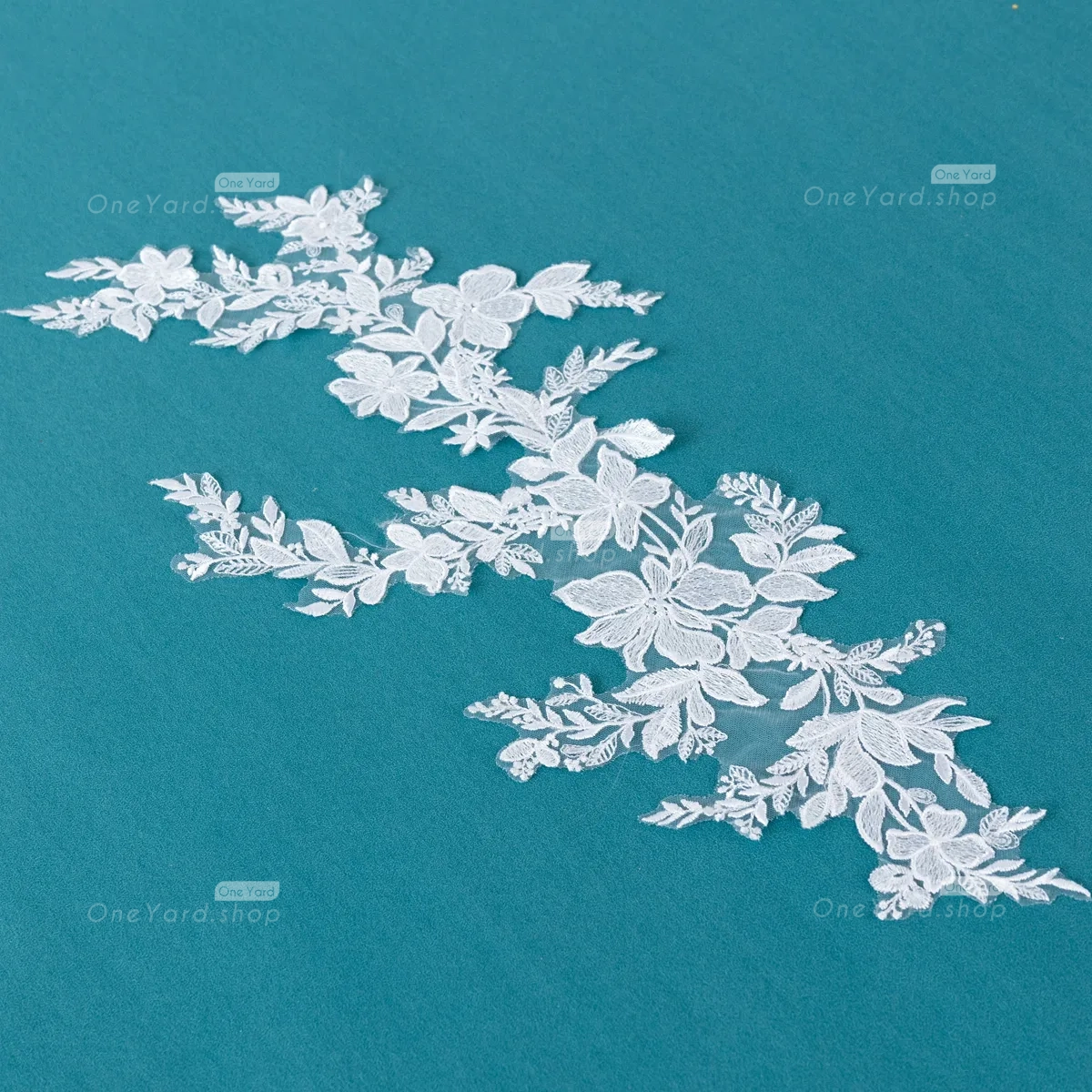 the white lace applique can be applied to various fabrics