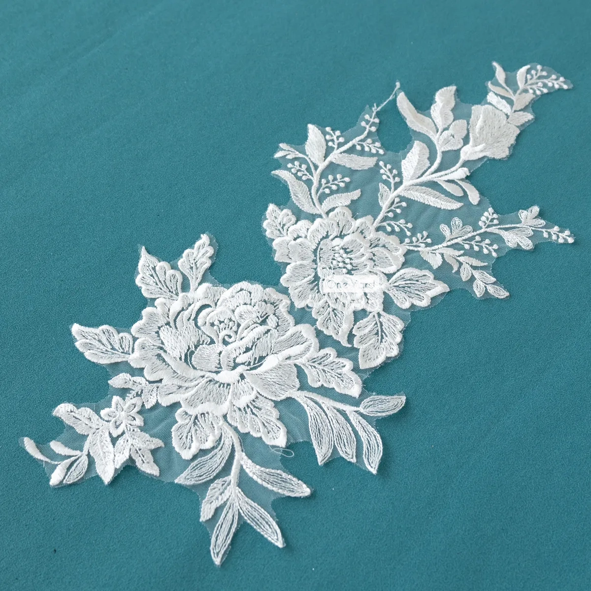 large intricate flowers and smaller leaves and branches lace motif