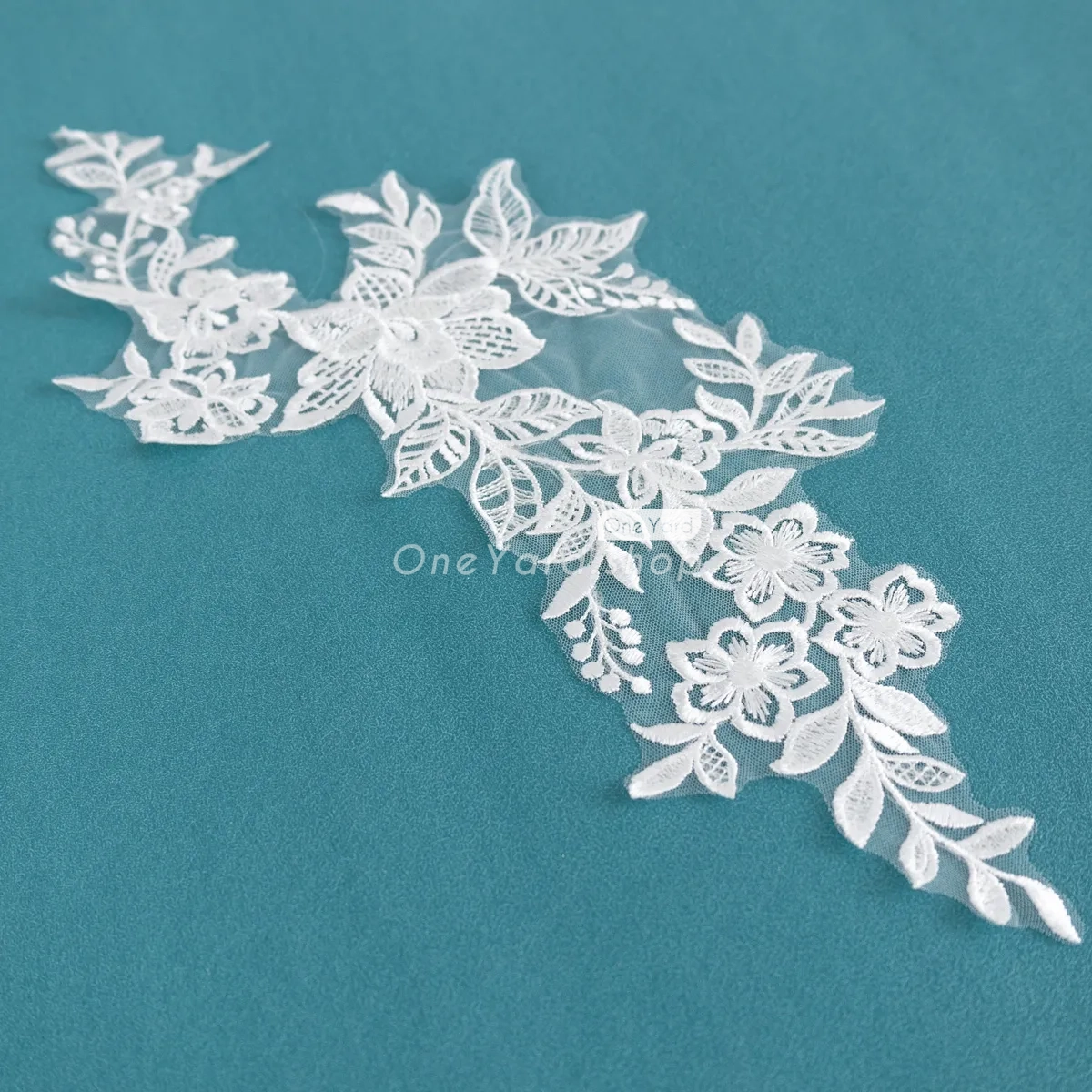 embroidered floral lace motifs adorned with clear sequins