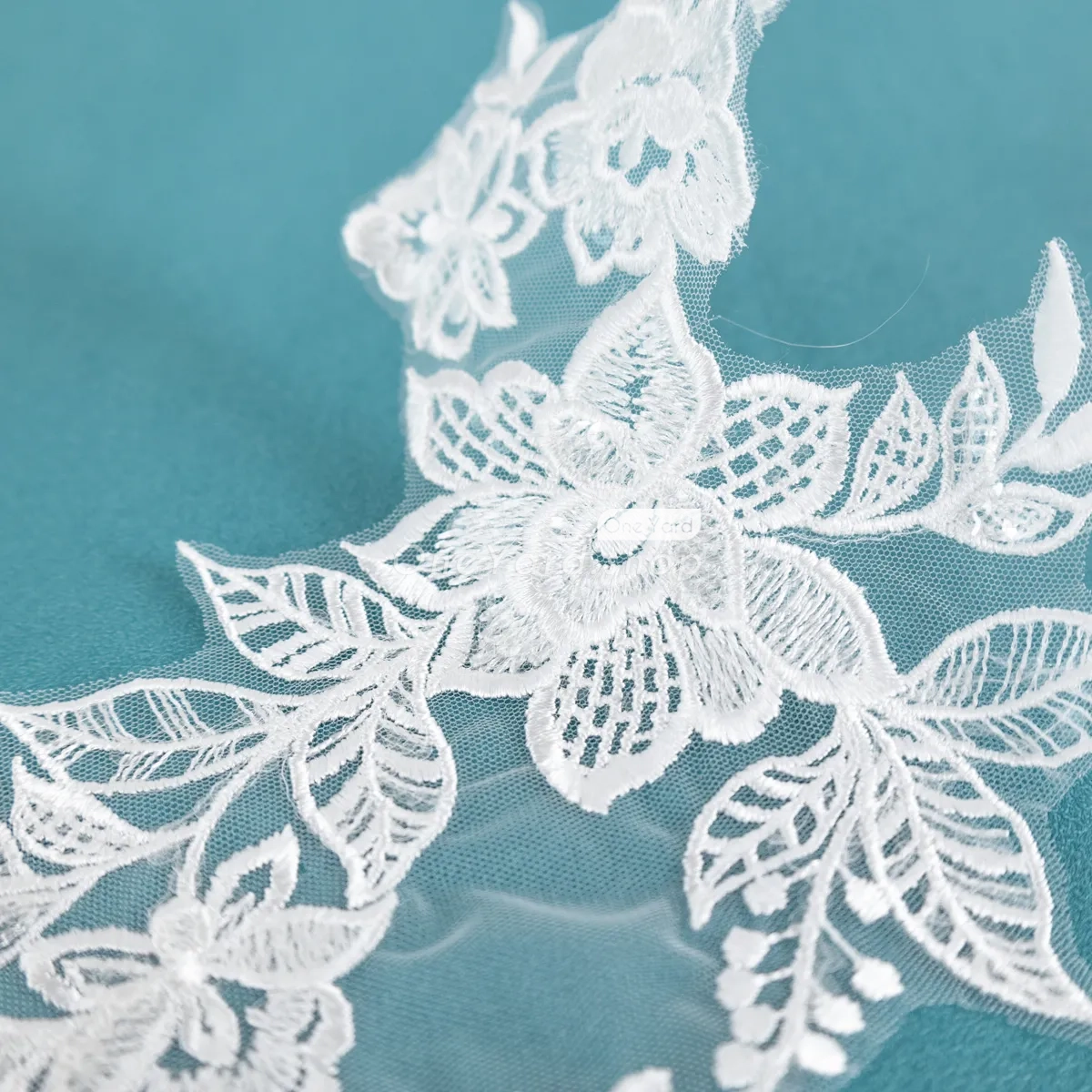 polyester floral lace motifs adorned with clear sequins