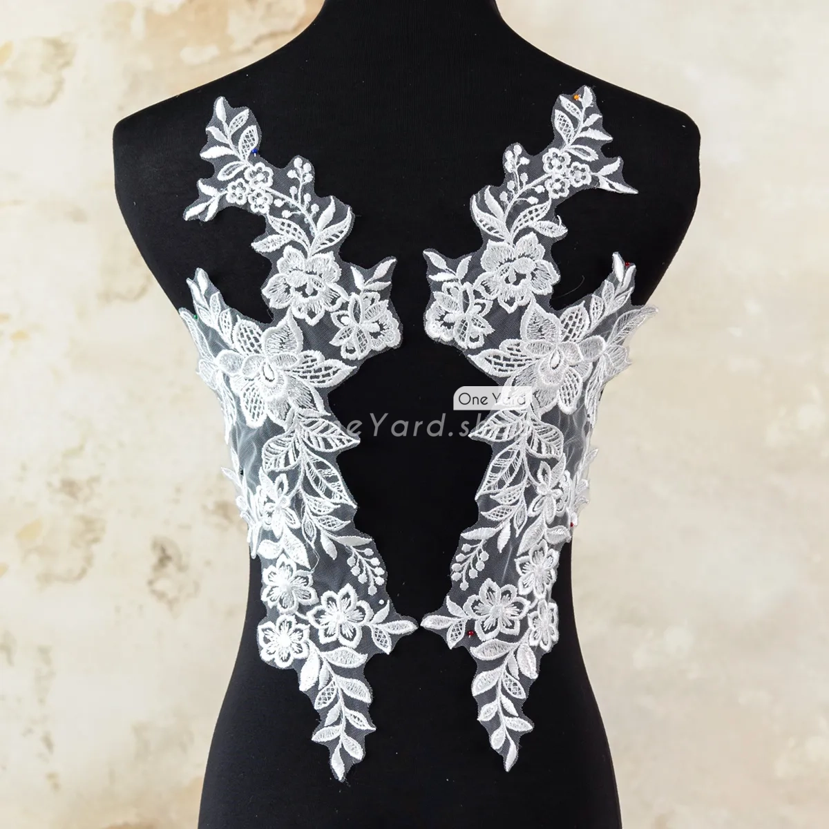 sequinned off white floral lace motifs