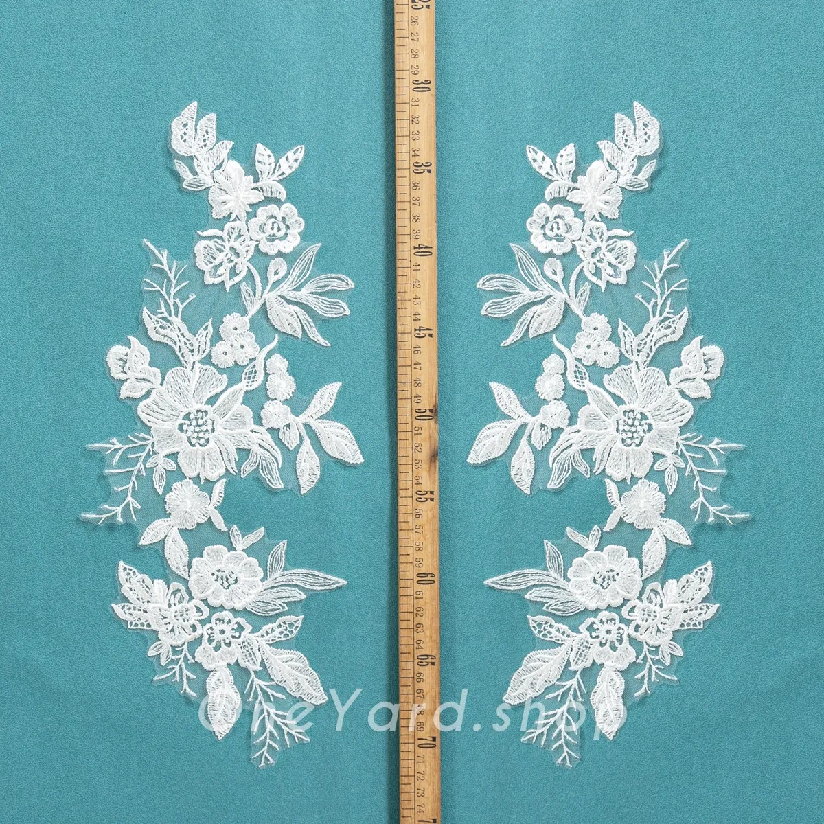 symmetrical off white floral lace motifs symmetrical off white floral lace motifs
