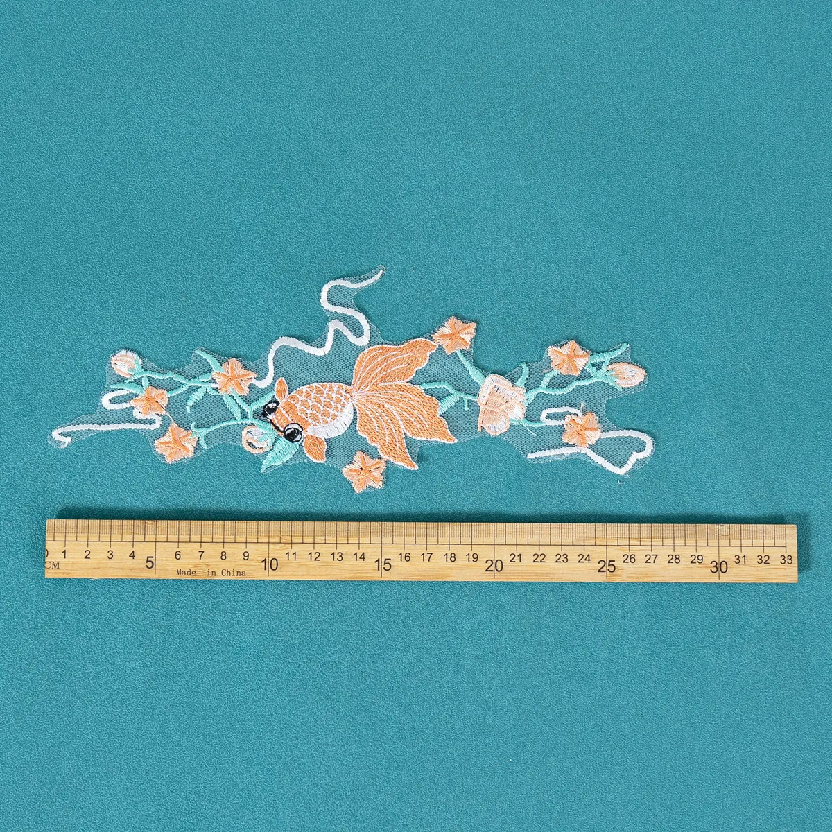 showcasing fish shapes and floral detail lace motif