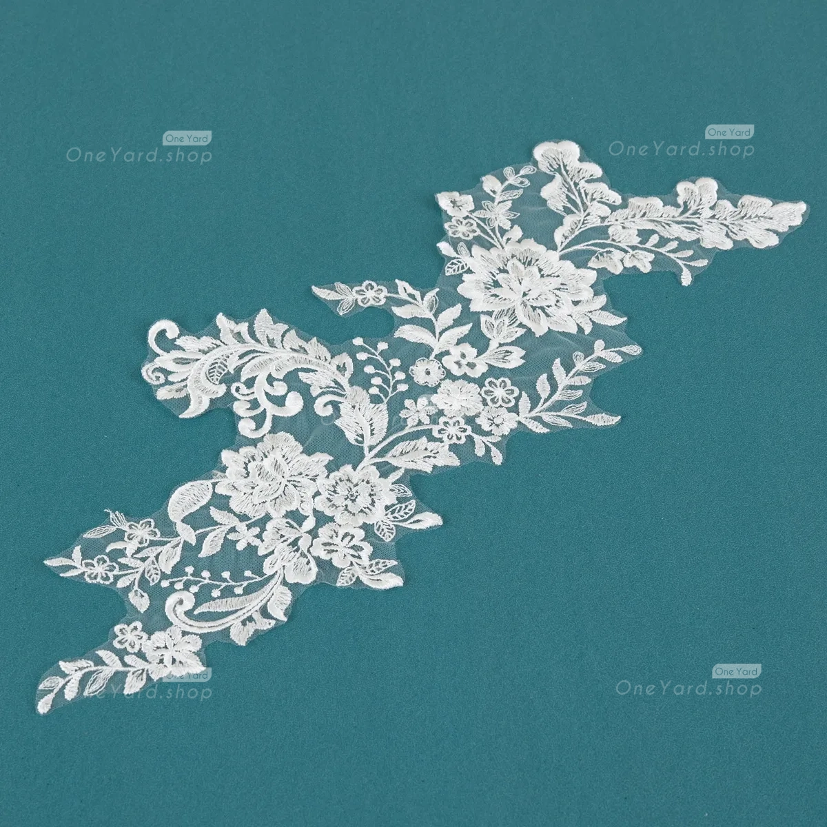 lace applique with intricate details and delicate clear sequins