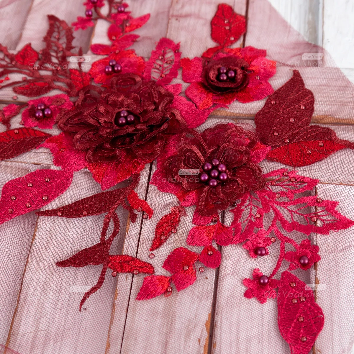 wine flower applique embellished with small pearls and beads