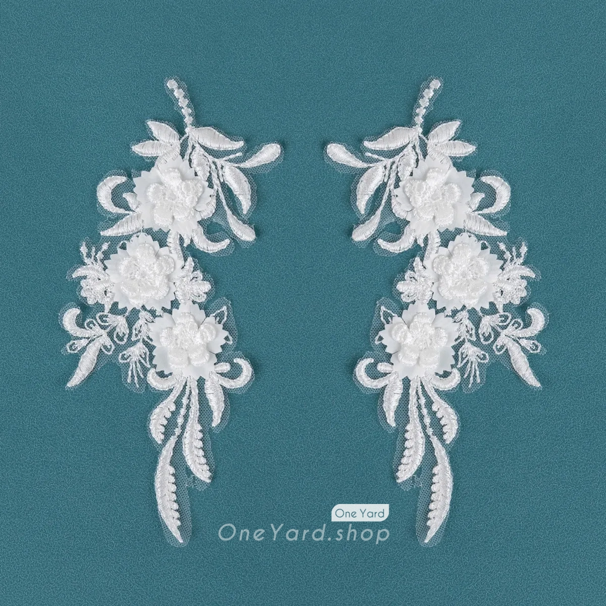 delicate leaves and a cluster of raised 3D flowers
