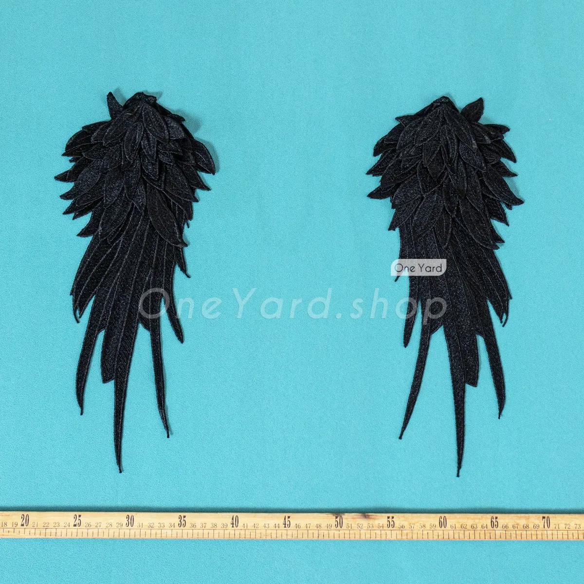 black wing shaped multiple layer appliques