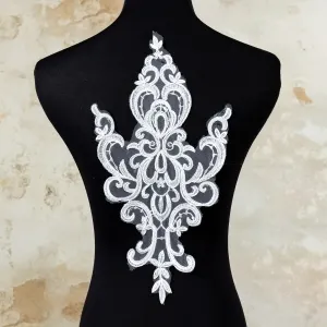 symmetrical abstract pattern corded lace applique