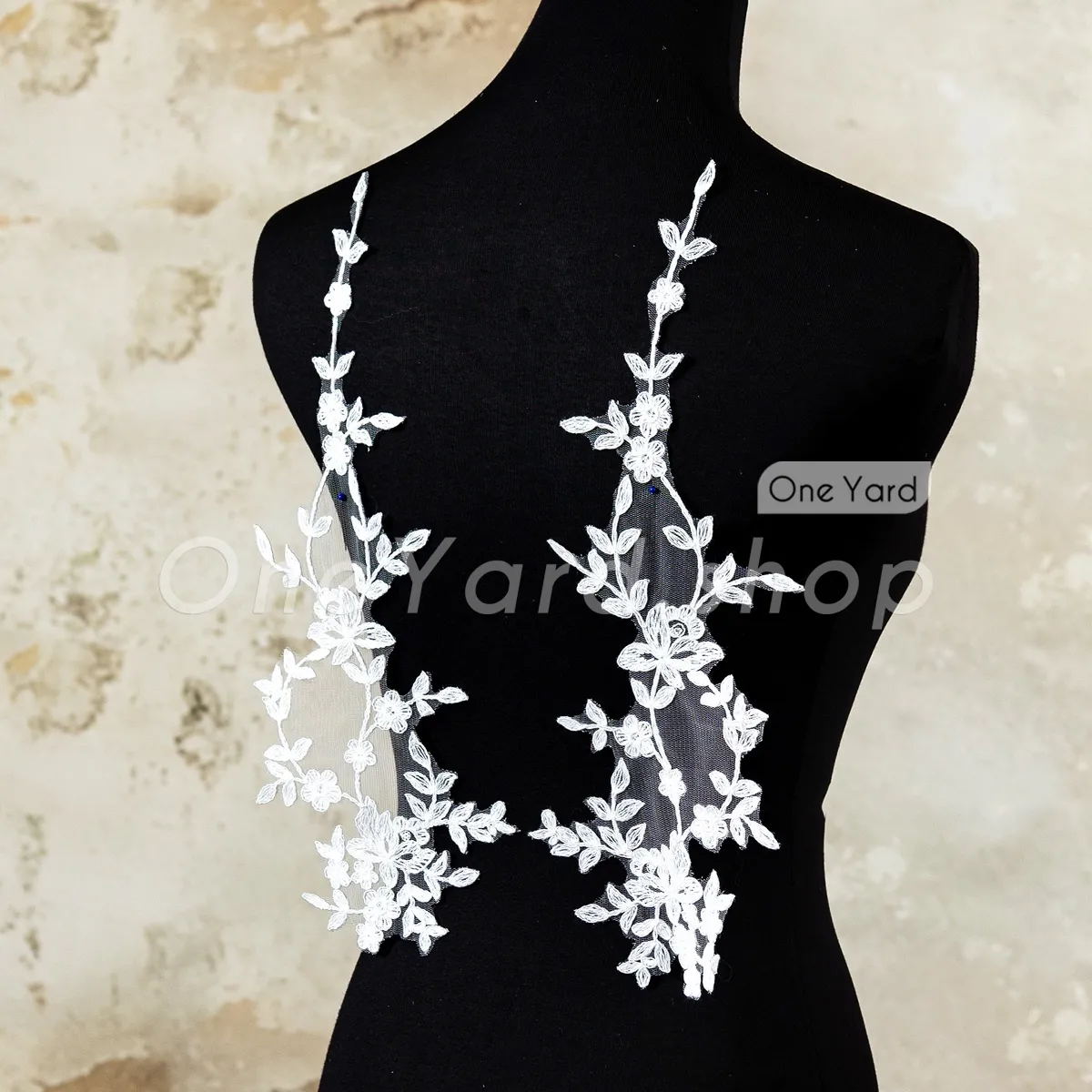 perfectly symmetrical pair of vine lace appliques