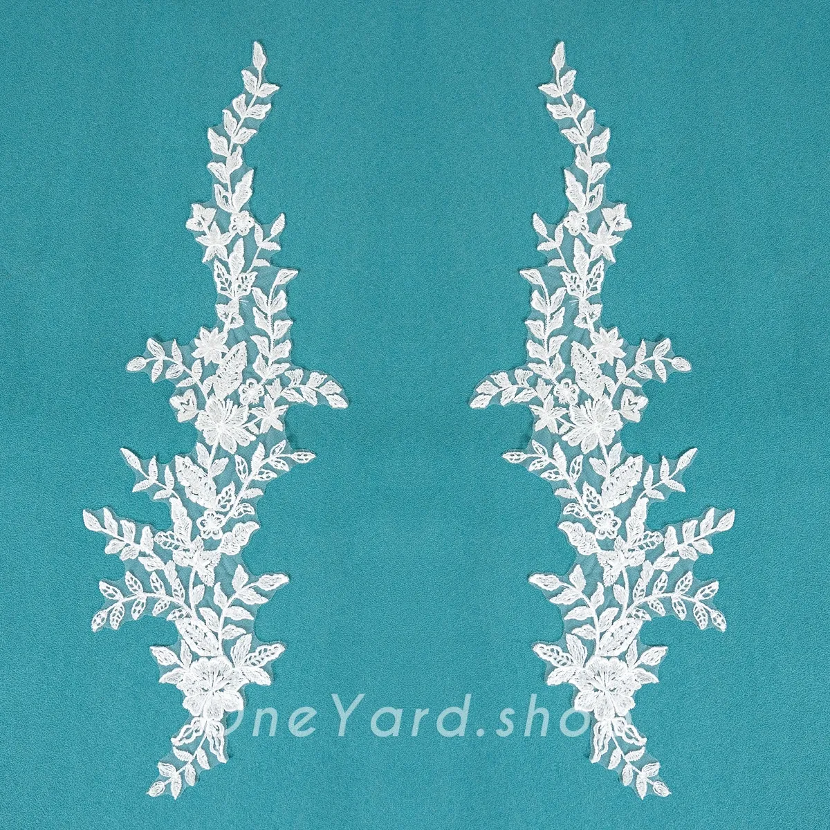 upward climbing leafy branch and blooming lace pair