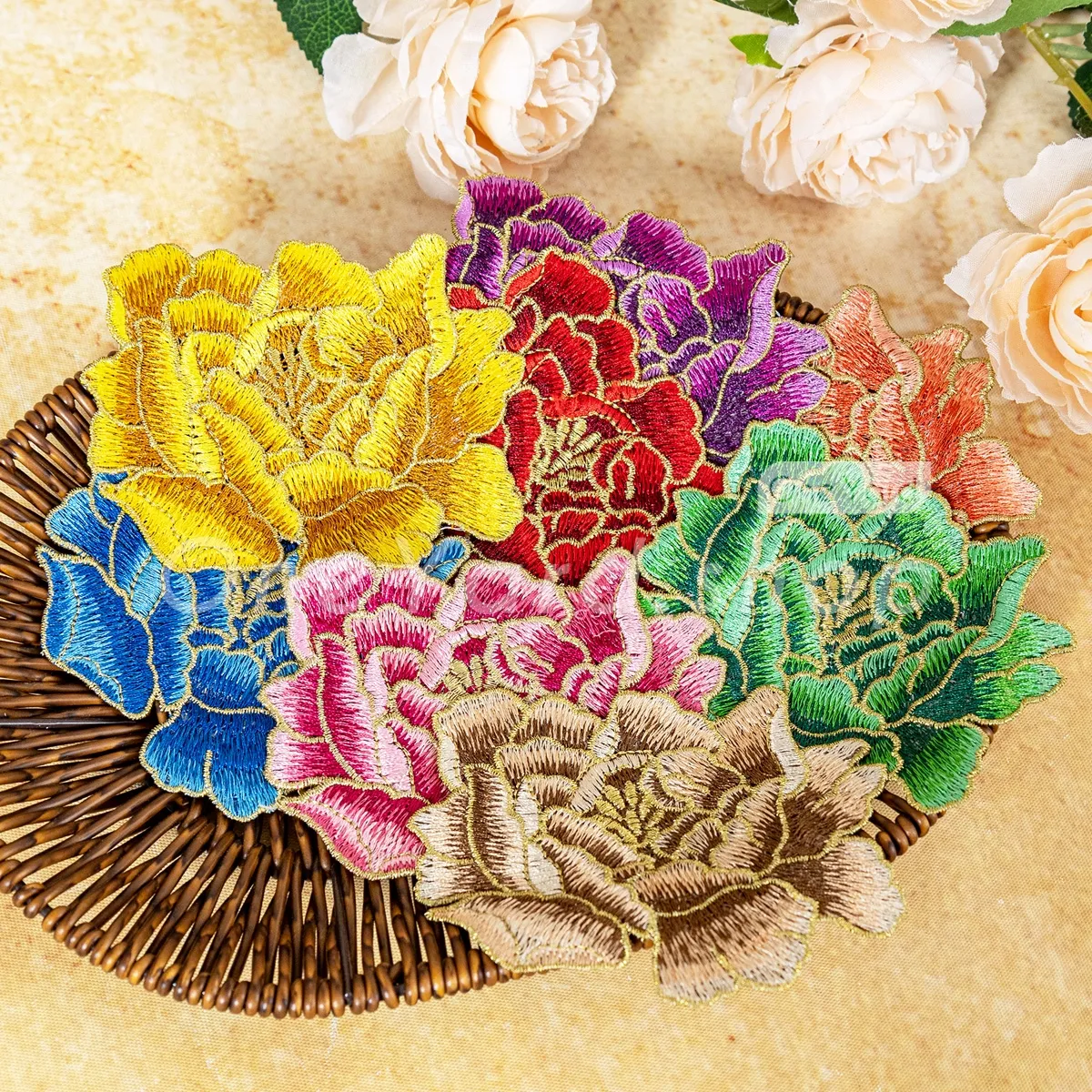 shimmering gold thread outlining soft flower applique