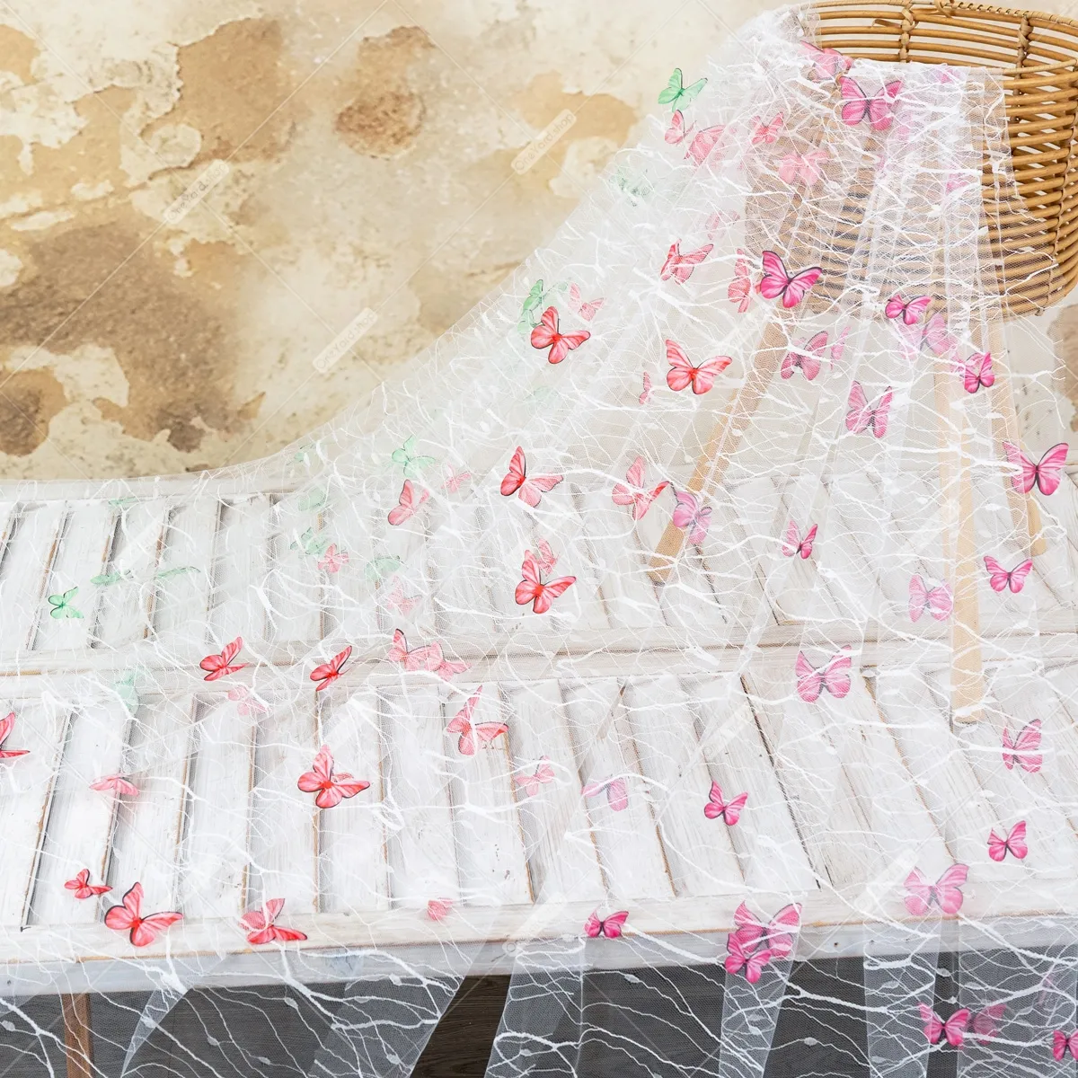 three dimensional butterfly embellishment on lightweight mesh