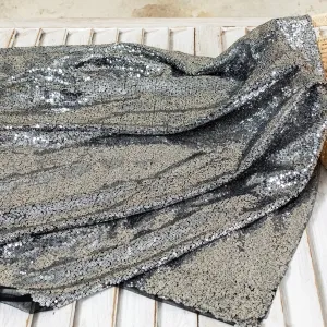 contrast sparkling silver sequins and black mesh fabric