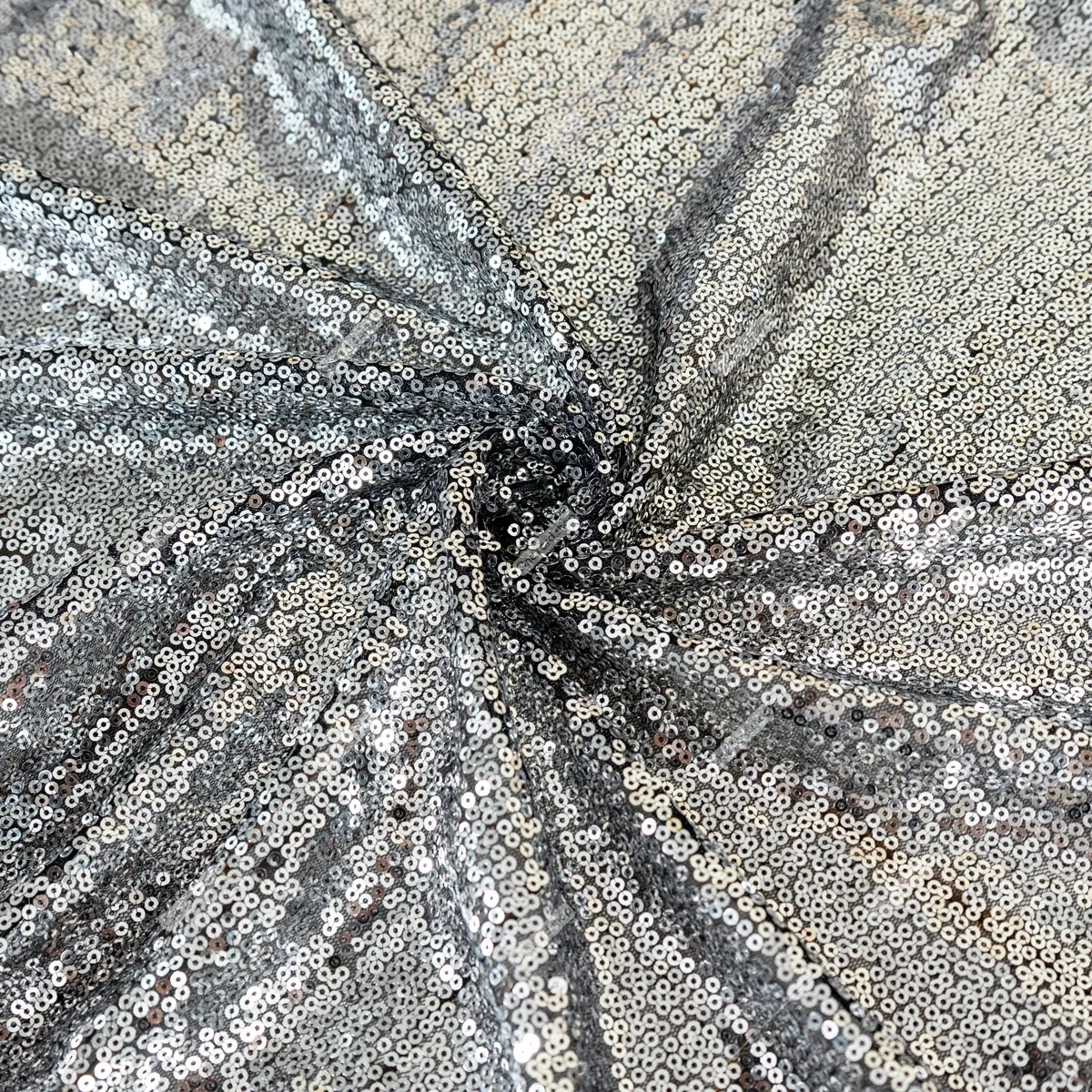 silver sequin fabric with a black mesh backing silver sequin fabric with a black mesh backing