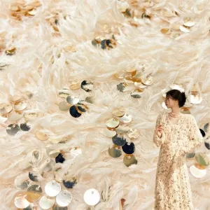 sequinned feather like tactile shaggy knit plush fabric