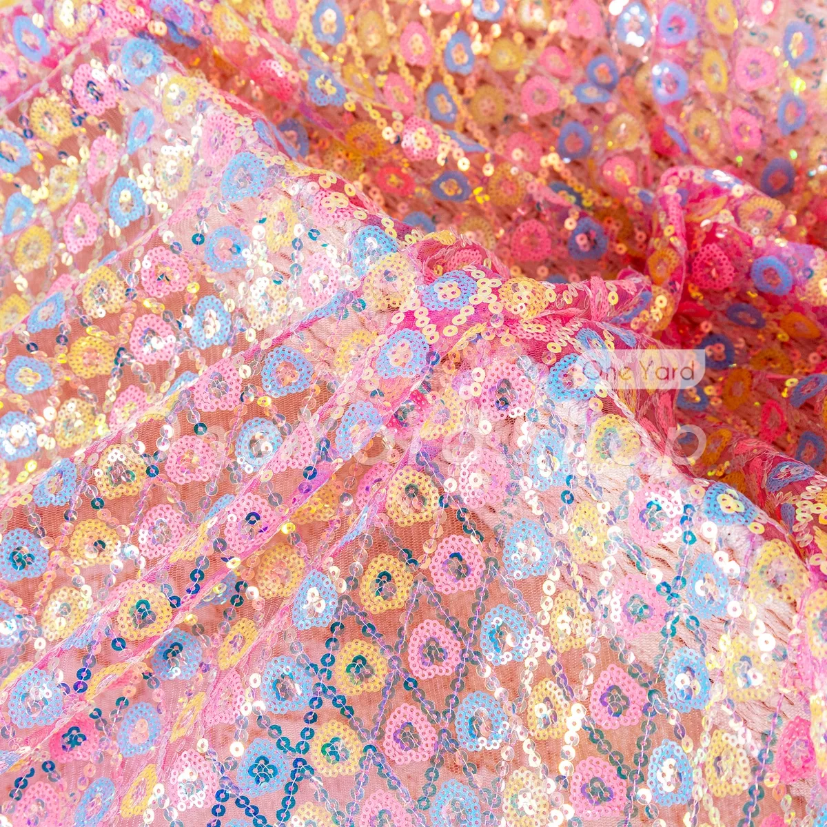 pink and yellow and blue sequins in heart shape pink and yellow and blue sequins in heart shape