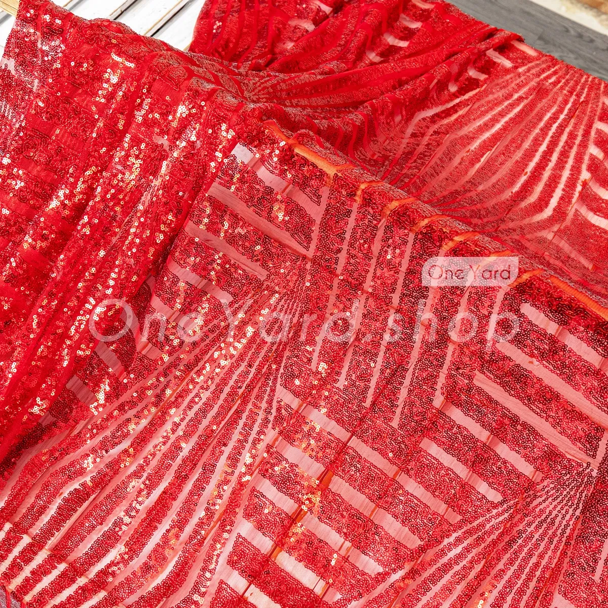 red geometric sequin embroidered on sheer red mesh base red geometric sequin embroidered on sheer red mesh base