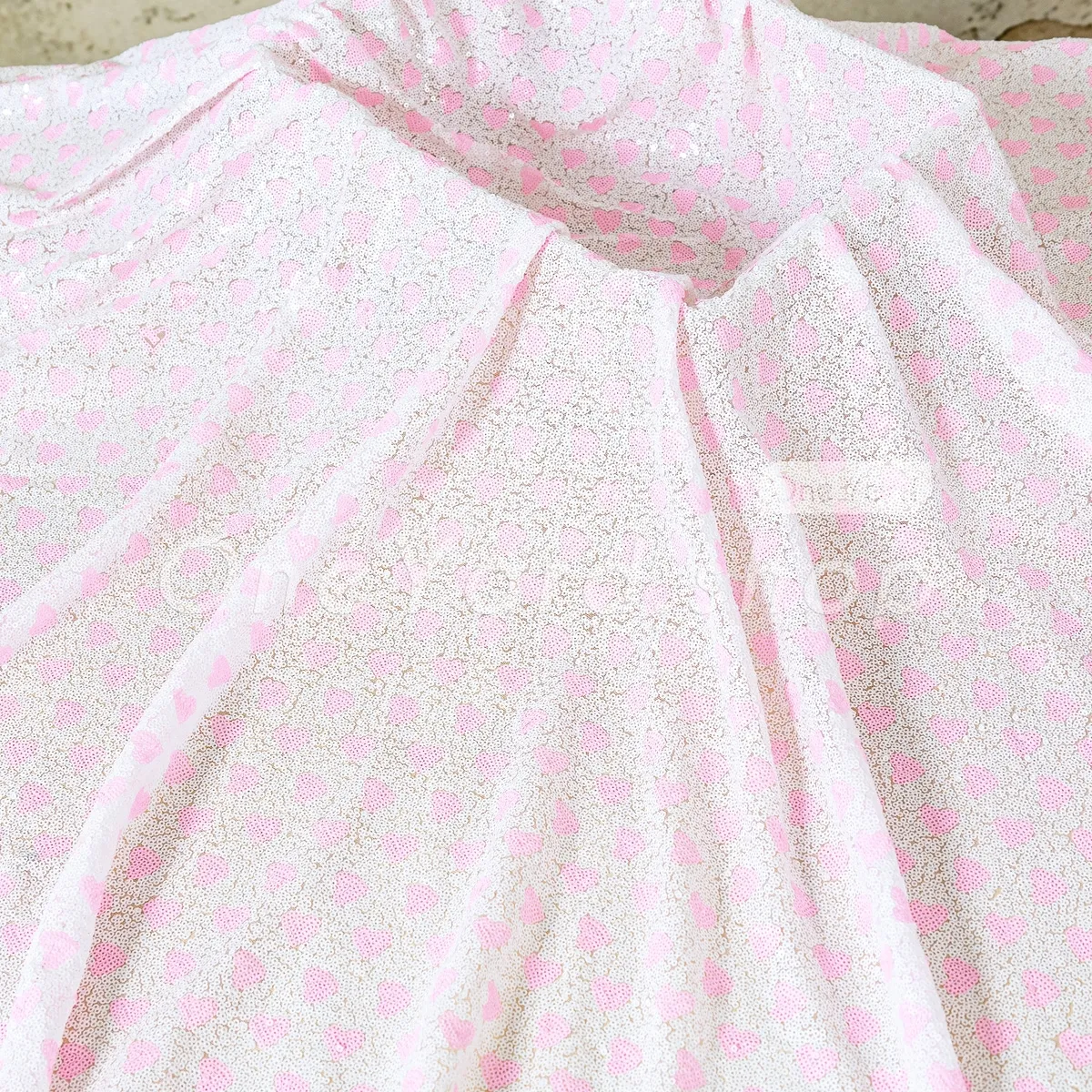 shimmering soft pink heart and white sequin fabric shimmering soft pink heart and white sequin fabric