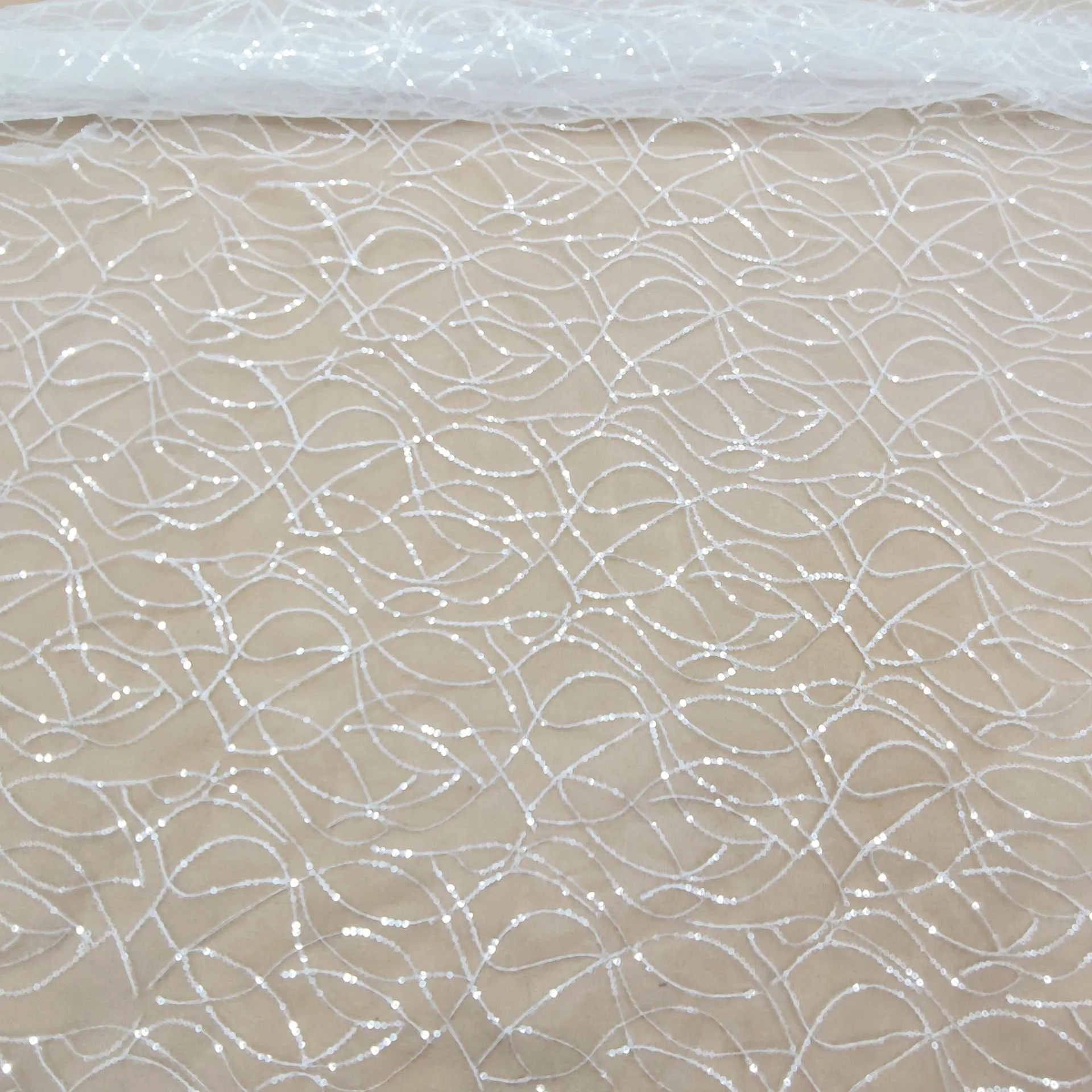 shimmering clear sequin wave pattern white mesh fabric shimmering clear sequin wave pattern white mesh fabric
