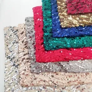 dynamic swirling wave ripple glitz sequined mesh fabric