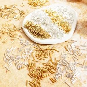 medium length gold and silver plastic bugle tube beads