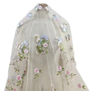pom pom blossoms and green stems embroidery mesh fabric