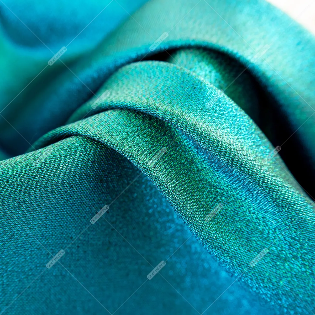 iridescent green and aqua metallic fabric