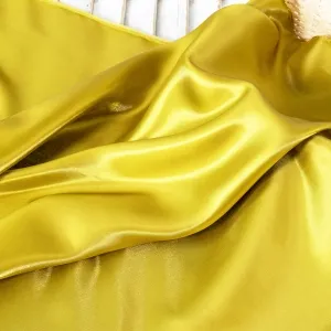 dark gold glossy liquid smooth crystal satin fabric