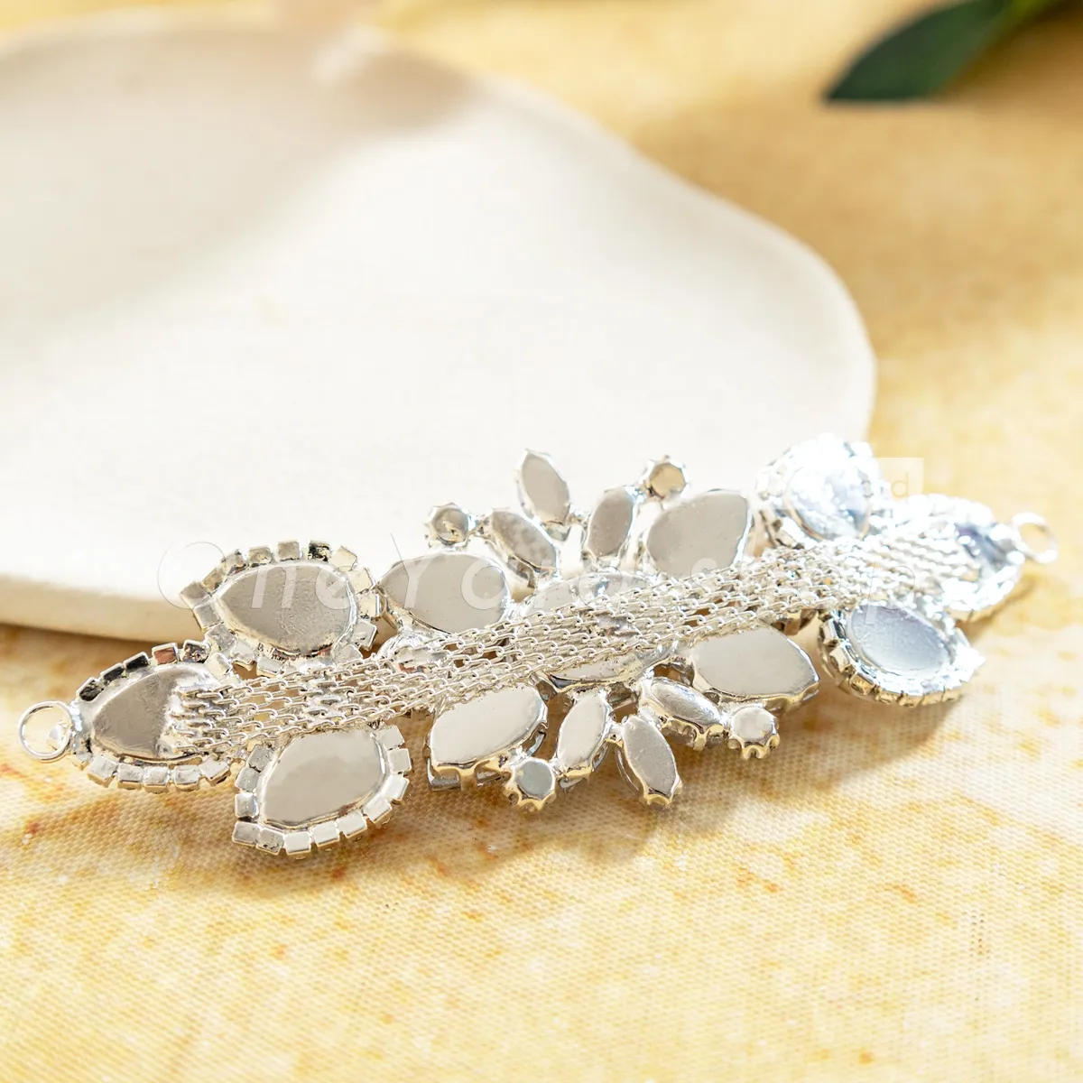 glass crystal motif with shiny silver claw mounts glass crystal motif with shiny silver claw mounts